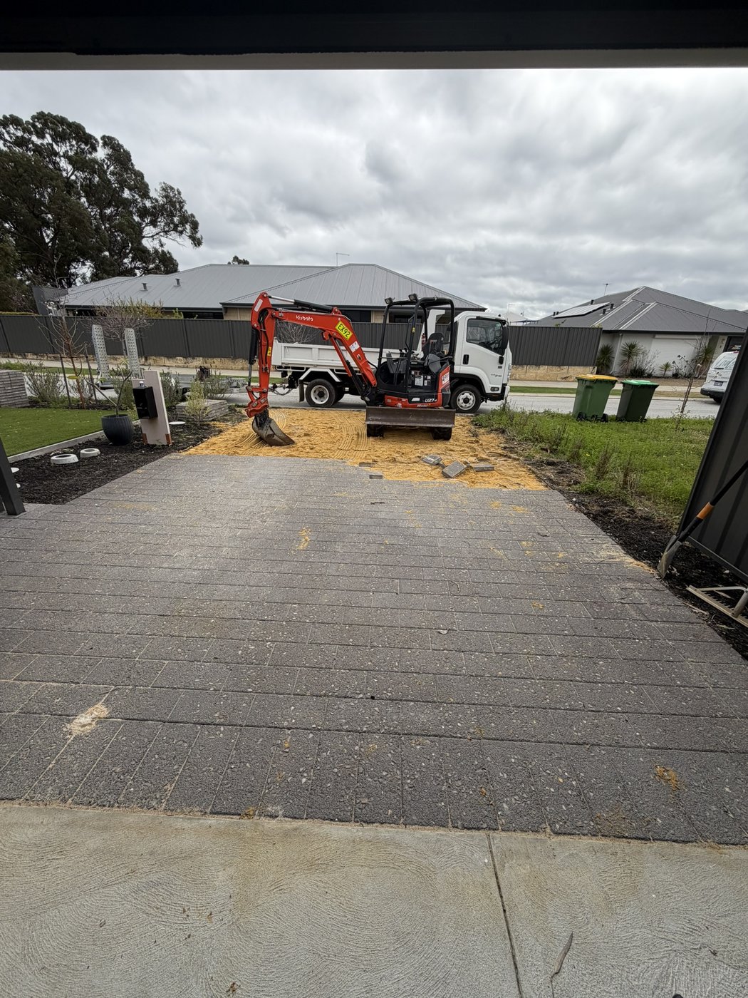 Driveway construction with excavator